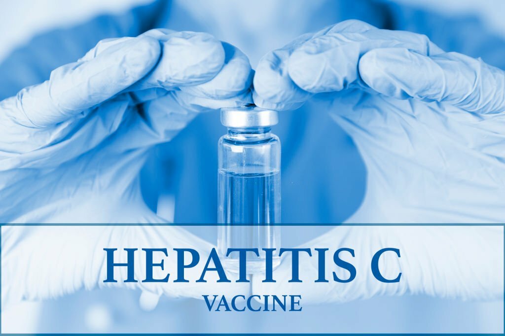 Hepatitis C vaccine. medical ampoule in the hands of a doctor. Vaccination awareness concept. Toned image. Soft blurred background. Medical poster. High quality photo