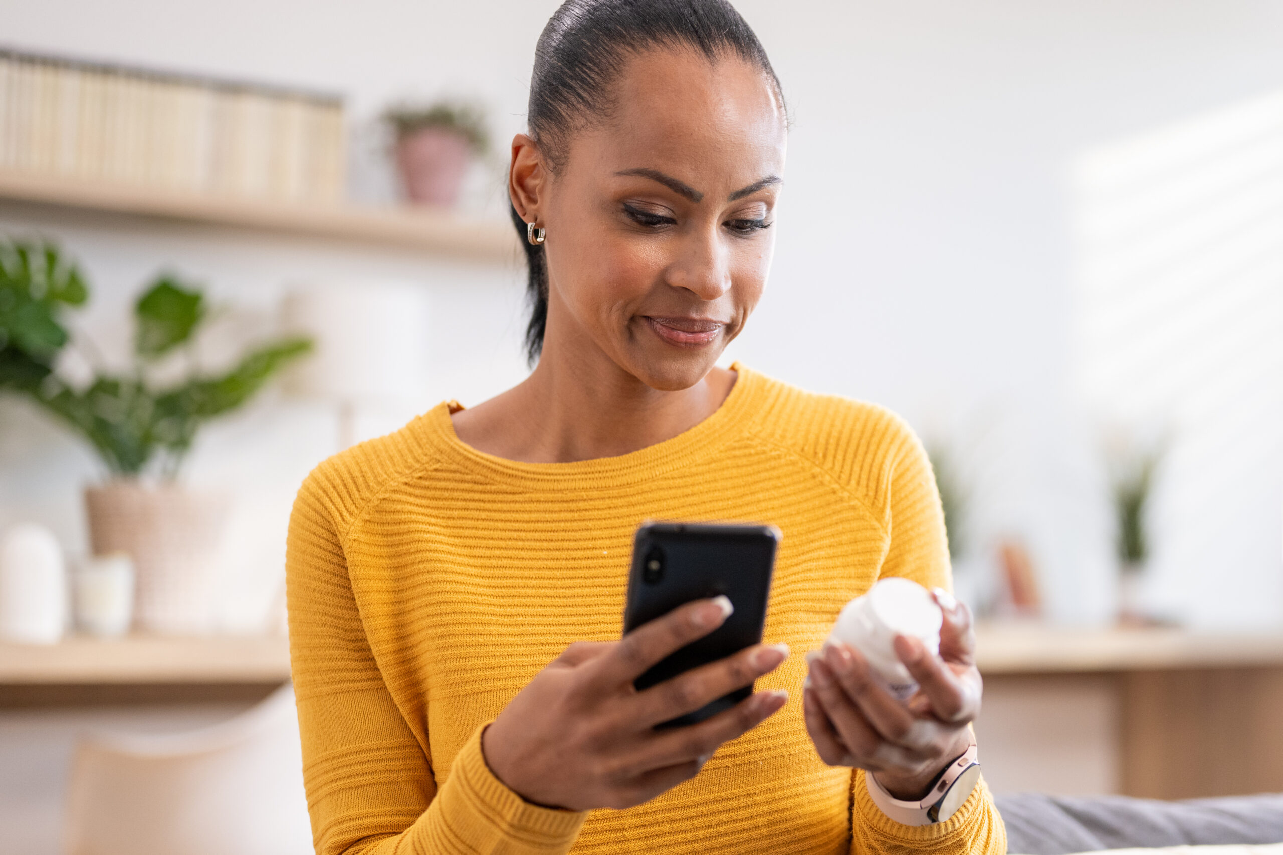 A long-distance caregiver monitors his father's health remotely with Ayuda Health